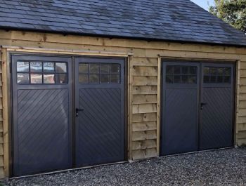 Two side hinged garage doors with windows in Anthracite Grey